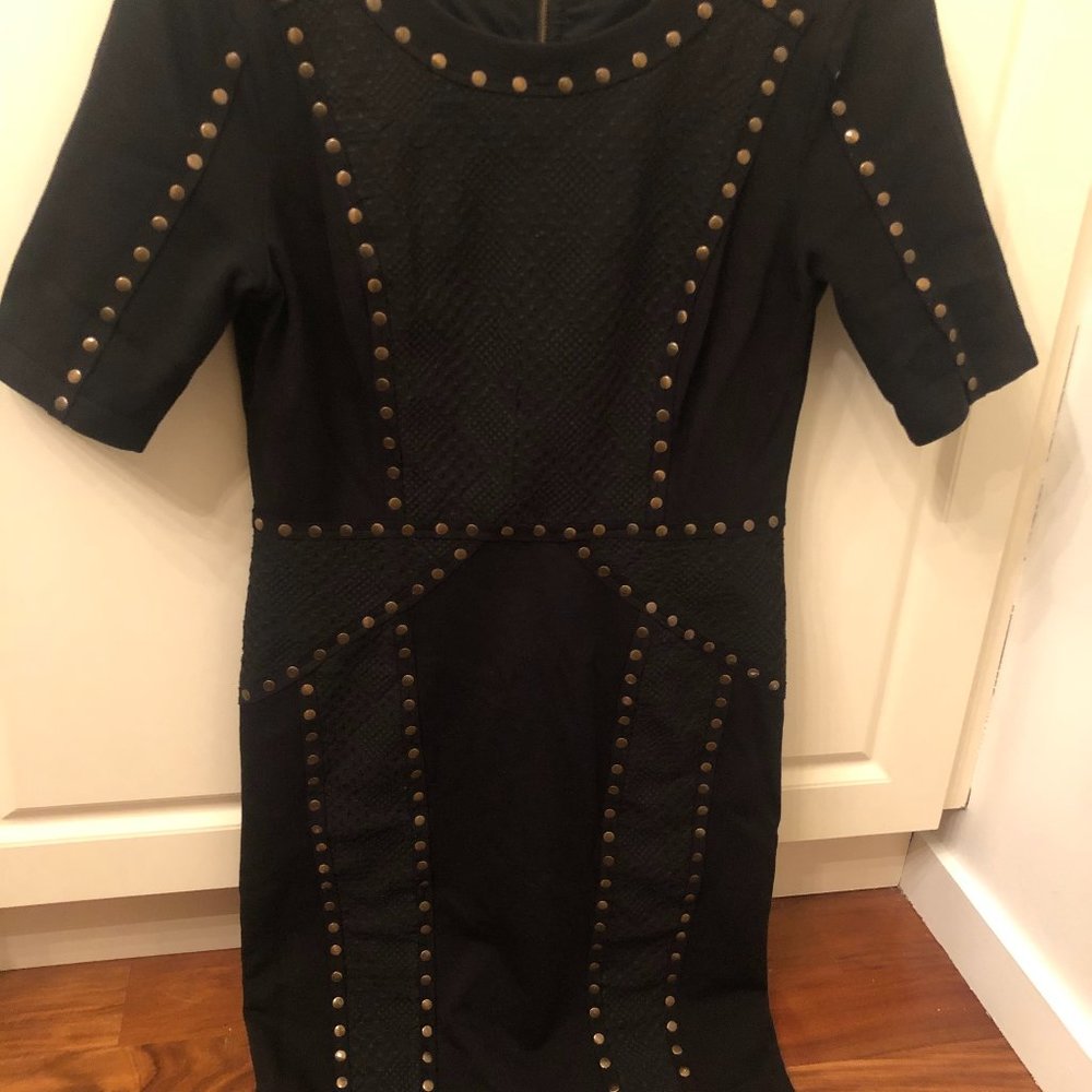 Black knee length dress with gold accent
